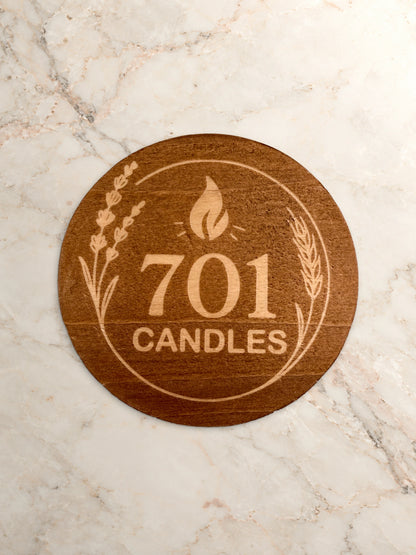 701 Candles wooden lid with engraved logo and prairie details on warm marble