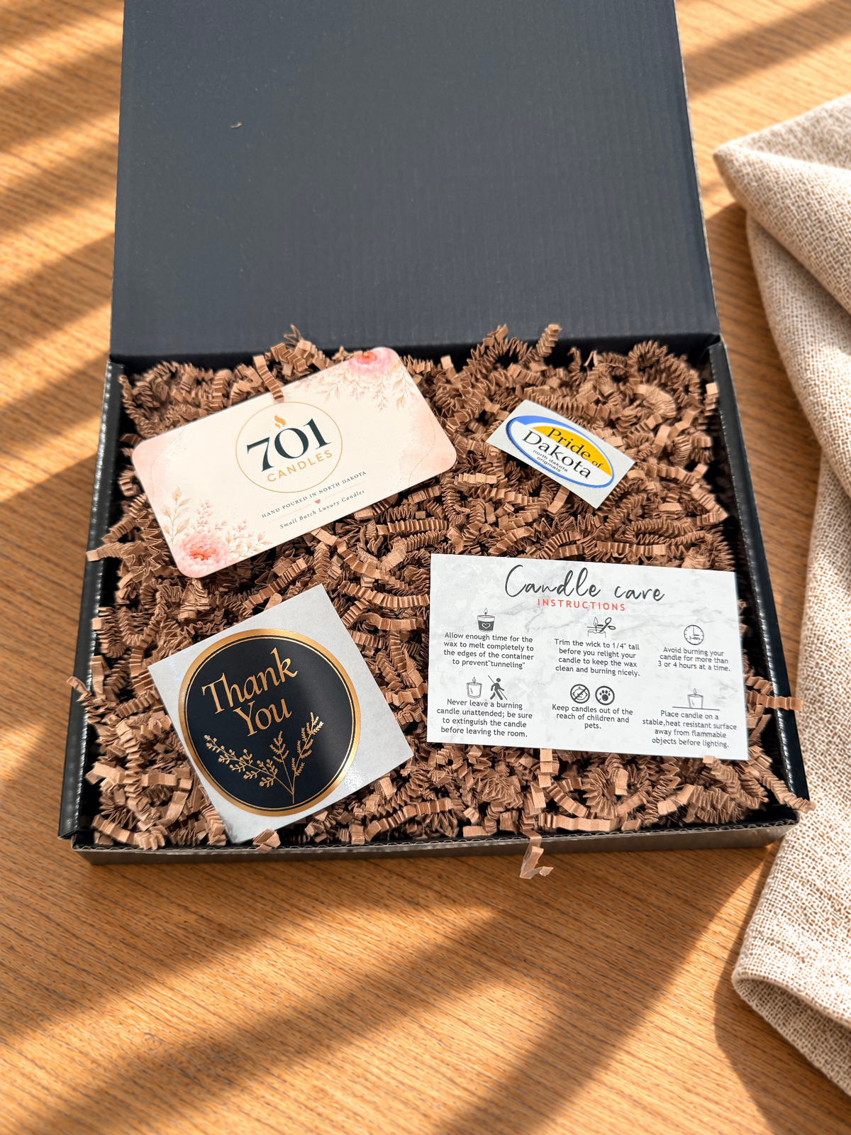 The Double Pour box with its candle care and 701 Candles cards