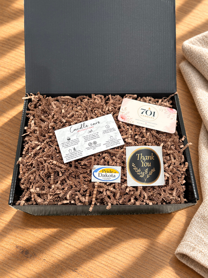 The Triple Pour box with its candle care and 701 Candles cards