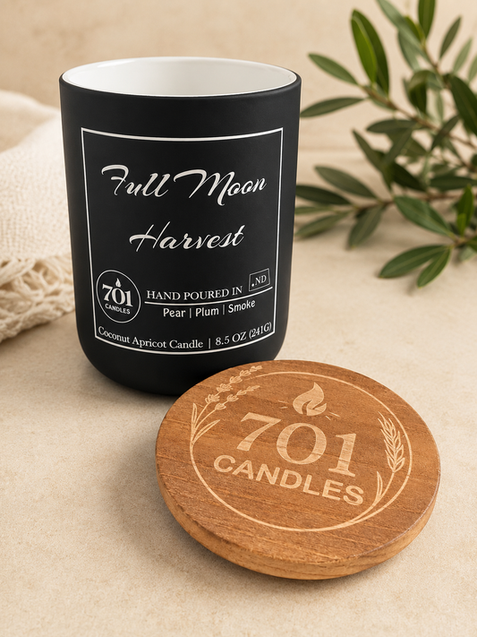 Full Moon Harvest hand-poured coconut apricot candle in matte black tumbler with wooden lid