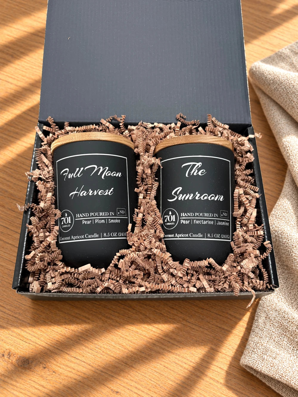 The Double Pour candles in their open gift box
